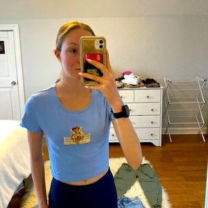 Baby blue cropped top with Angel design on front, size small